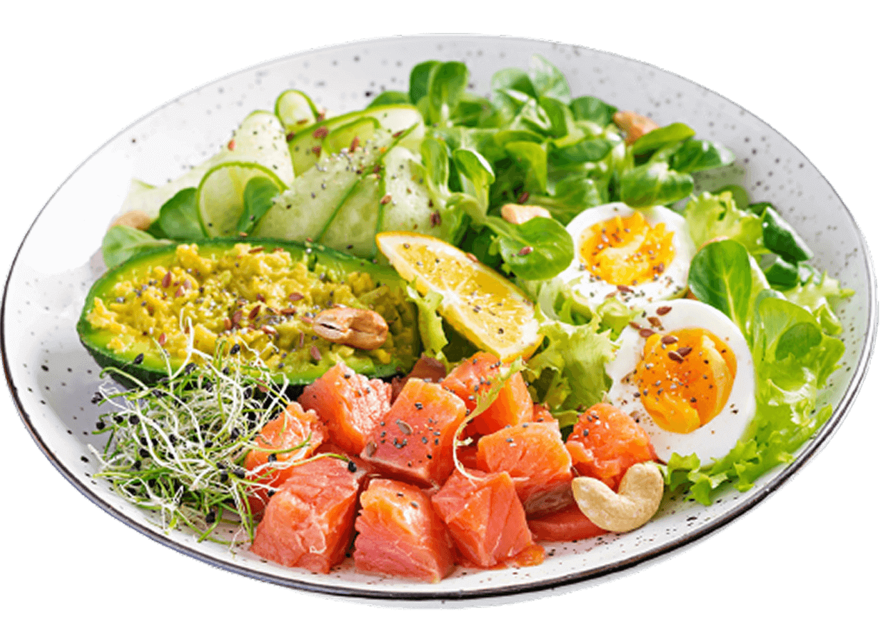 Healthy salad bowl with fresh salmon cubes, boiled eggs, avocado, cucumber, greens, sprouts, and lemon, representing a balanced high-protein meal.